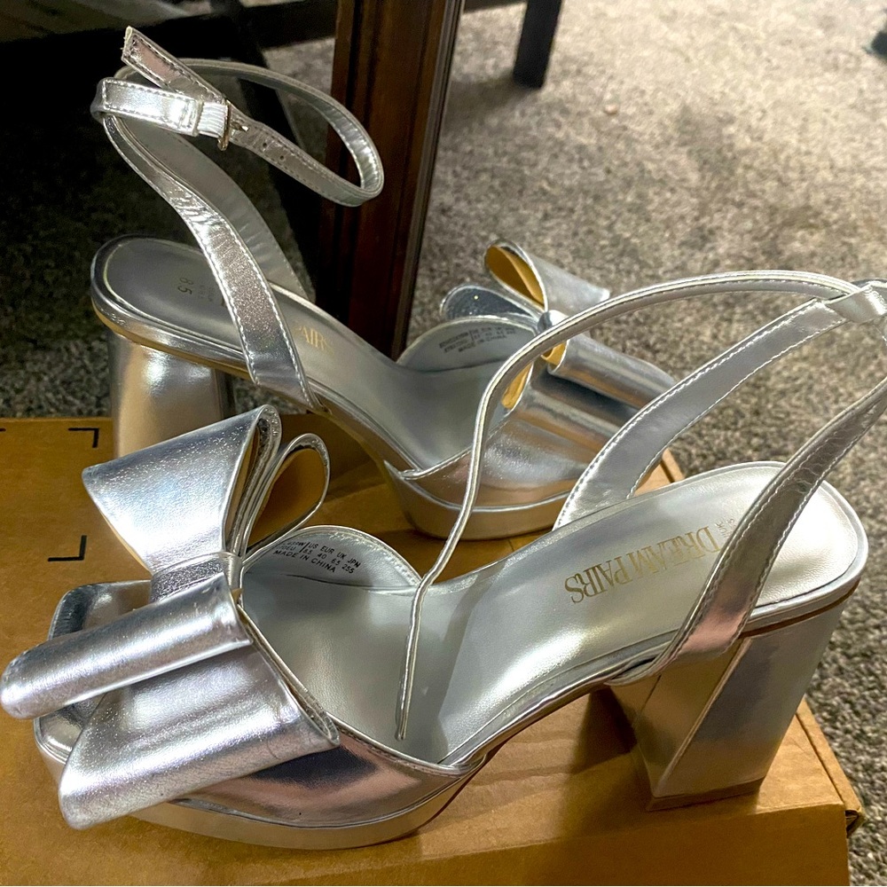 Silver Bow Heels, size 8.5. Bought online and they were too big.